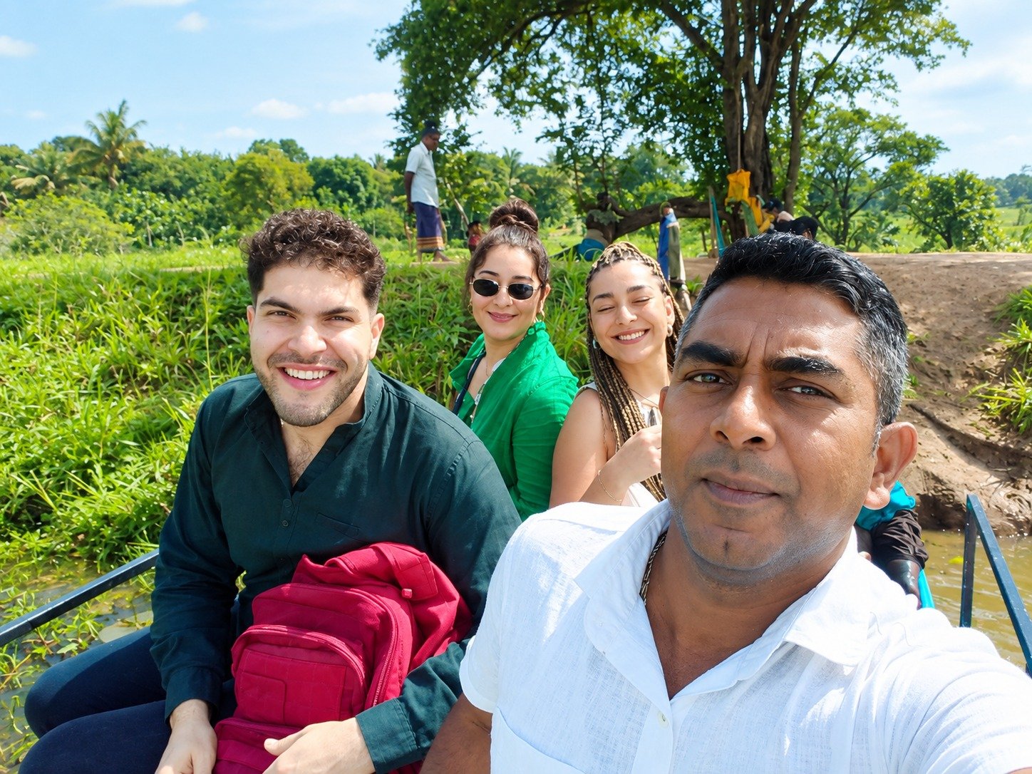 Friends enjoying a serene village lake safari boat ride
